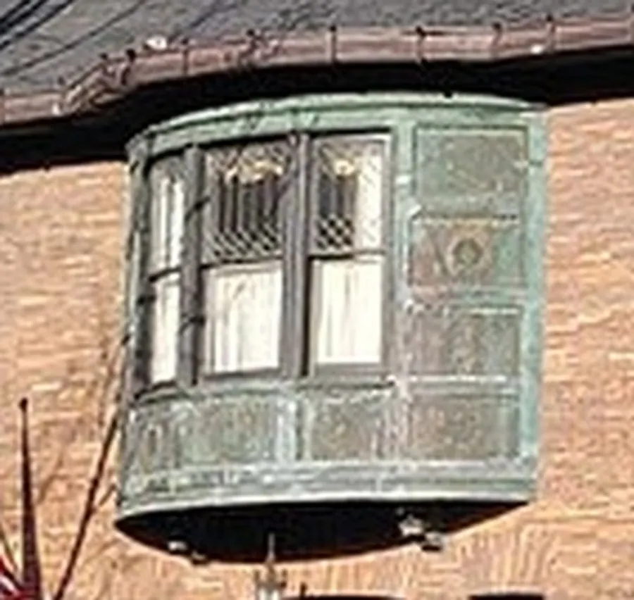 The verdigris bay window, executed